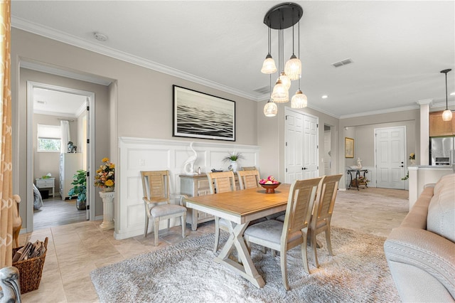 9925 SW 95th Loop, Ocala, FL 34481 - dining room with ornamental molding and a decorative wall