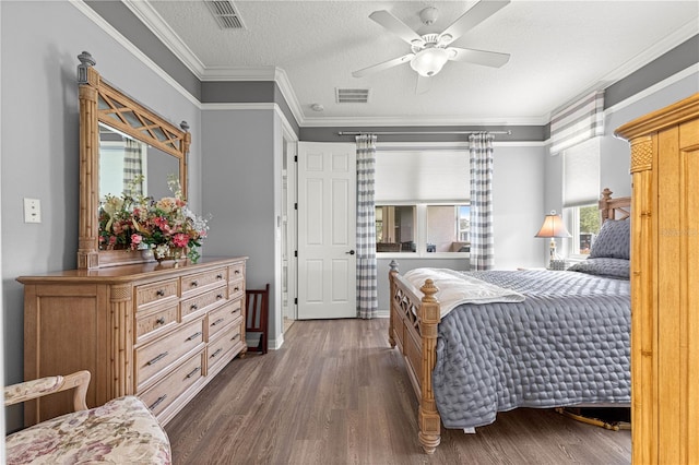 9925 SW 95th Loop, Ocala, FL 34481 - bedroom with dark wood finished floors, crown molding, a ceiling fan, and a textured ceiling