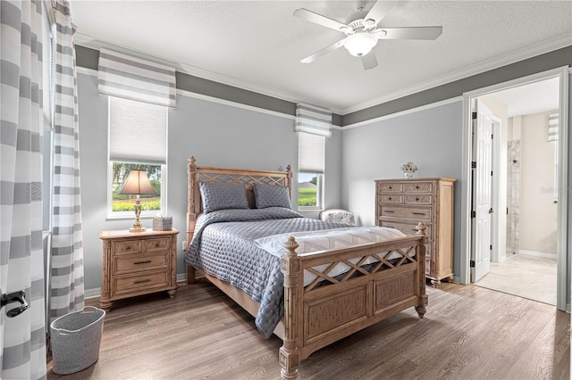 9925 SW 95th Loop, Ocala, FL 34481 - bedroom featuring light wood-type flooring, crown molding, a textured ceiling, and a ceiling fan