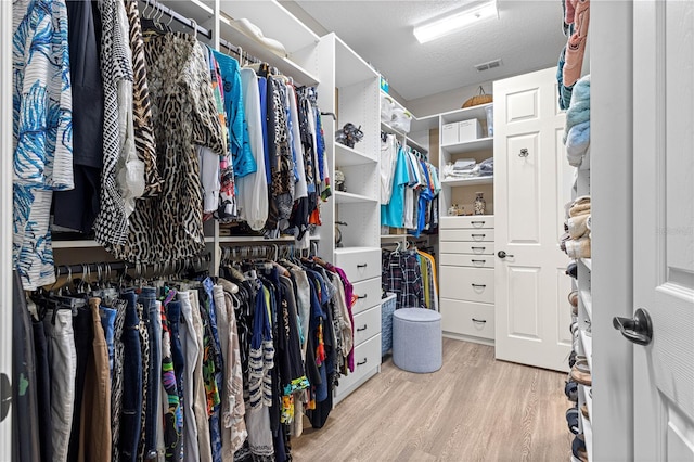 9925 SW 95th Loop, Ocala, FL 34481 - spacious closet with wood finished floors