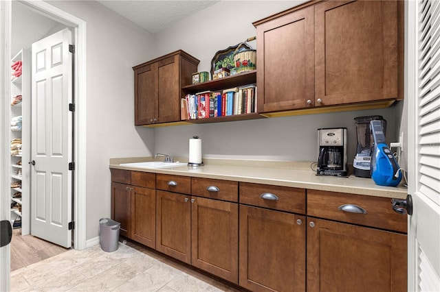 9925 SW 95th Loop, Ocala, FL 34481 - kitchen with light countertops, open shelves, and brown cabinetry