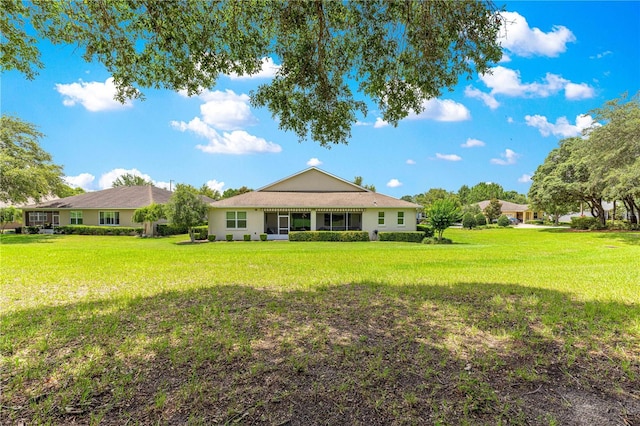 9925 SW 95th Loop, Ocala, FL 34481 - back of house with a yard
