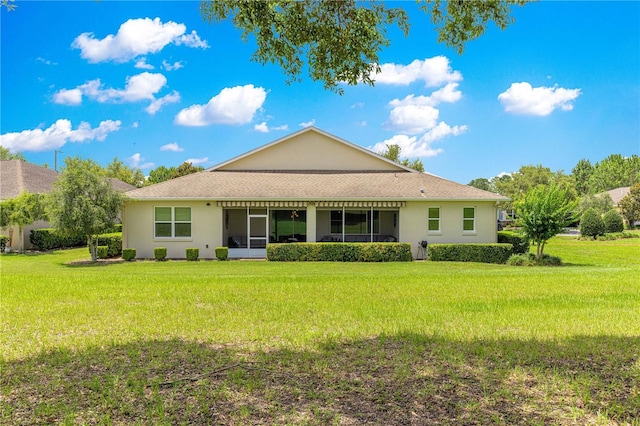 9925 SW 95th Loop, Ocala, FL 34481 - back of property featuring a lawn and stucco siding