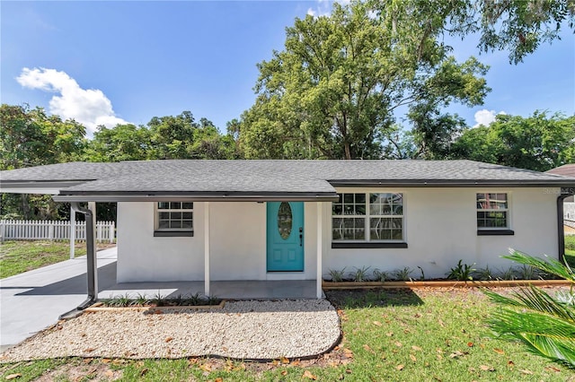 1636 SW 5th Pl, Ocala, FL 34471 - ranch-style house featuring stucco siding, a shingled roof, and a carport