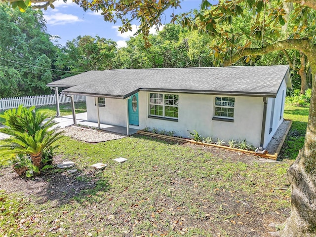 1636 SW 5th Pl, Ocala, FL 34471 - single story home with a shingled roof, stucco siding, and a patio area