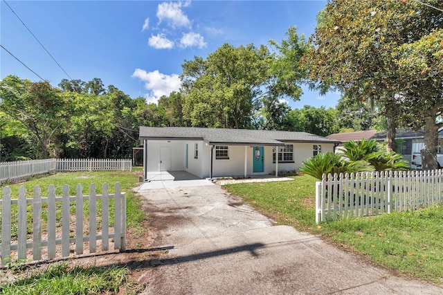 1636 SW 5th Pl, Ocala, FL 34471 - single story home featuring driveway, a carport, stucco siding, and a fenced front yard