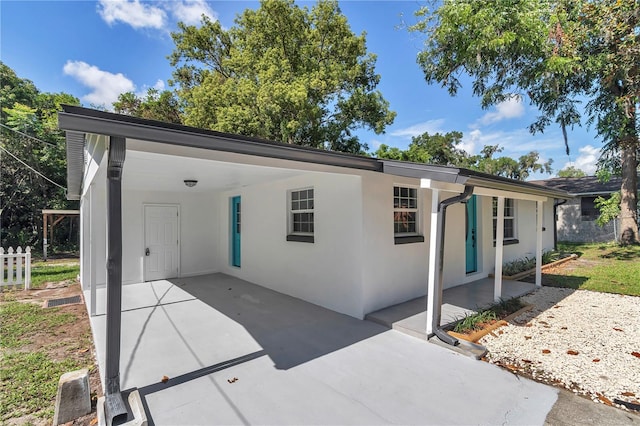 1636 SW 5th Pl, Ocala, FL 34471 - ranch-style home featuring stucco siding, a carport, and driveway