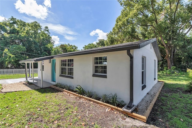 1636 SW 5th Pl, Ocala, FL 34471 - view of side of home with stucco siding