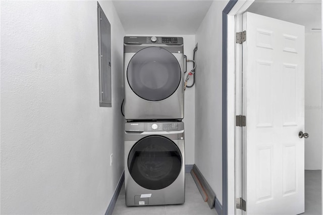 1636 SW 5th Pl, Ocala, FL 34471 - laundry room with stacked washer / drying machine and tile patterned floors