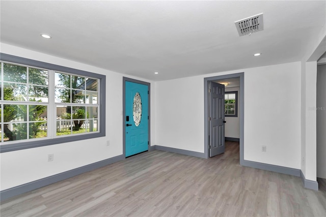 1636 SW 5th Pl, Ocala, FL 34471 - unfurnished living room with light wood-type flooring and recessed lighting