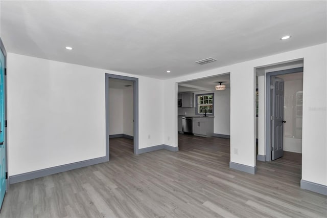 1636 SW 5th Pl, Ocala, FL 34471 - unfurnished living room with light wood finished floors and recessed lighting
