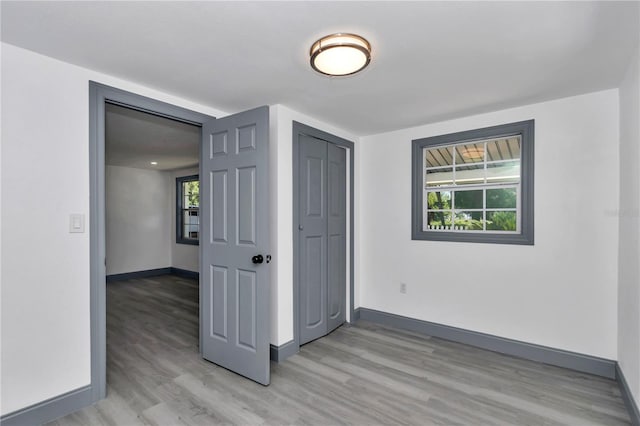 1636 SW 5th Pl, Ocala, FL 34471 - unfurnished room featuring light wood-style floors and healthy amount of natural light
