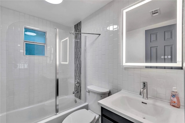 1636 SW 5th Pl, Ocala, FL 34471 - bathroom with tile walls, vanity, shower / washtub combination, and decorative backsplash