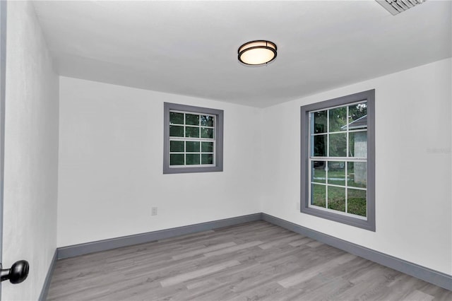 1636 SW 5th Pl, Ocala, FL 34471 - spare room with wood finished floors and baseboards