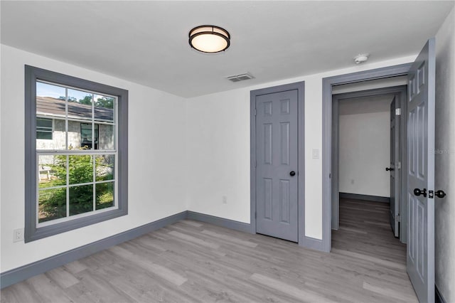1636 SW 5th Pl, Ocala, FL 34471 - unfurnished bedroom featuring light wood-type flooring and baseboards