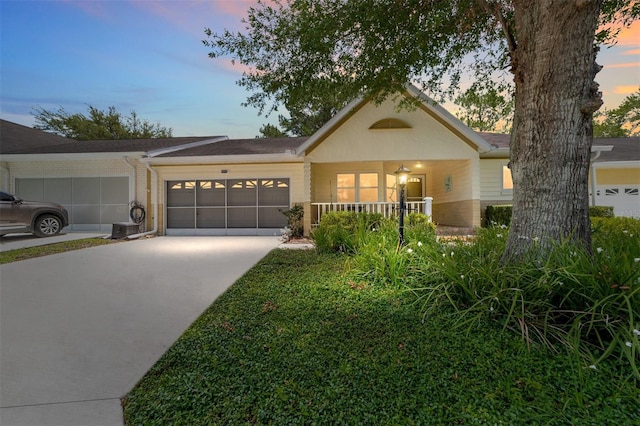 9085 SW 96th Ln Unit B, Ocala, FL 34481 - view of front of home featuring an attached garage, concrete driveway, and brick siding