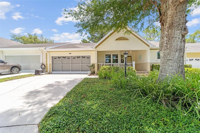 9085 SW 96th Ln Unit B, Ocala, FL 34481 - view of front of home with an attached garage, driveway, and brick siding