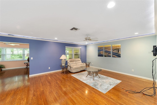 9085 SW 96th Ln Unit B, Ocala, FL 34481 - living room featuring a ceiling fan, wood finished floors, ornamental molding, and recessed lighting