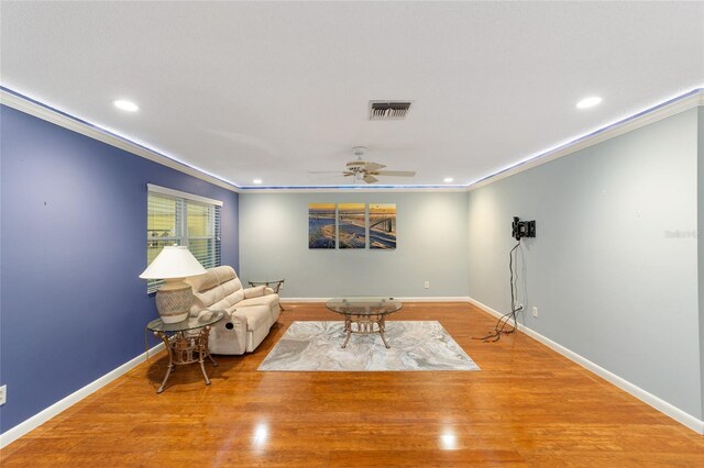 9085 SW 96th Ln Unit B, Ocala, FL 34481 - living area featuring ornamental molding, recessed lighting, a ceiling fan, and wood finished floors