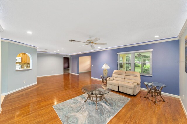 9085 SW 96th Ln Unit B, Ocala, FL 34481 - living room featuring ornamental molding, wood finished floors, a ceiling fan, and recessed lighting