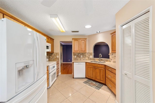 9085 SW 96th Ln Unit B, Ocala, FL 34481 - kitchen with white appliances, light countertops, tasteful backsplash, light tile patterned flooring, and recessed lighting