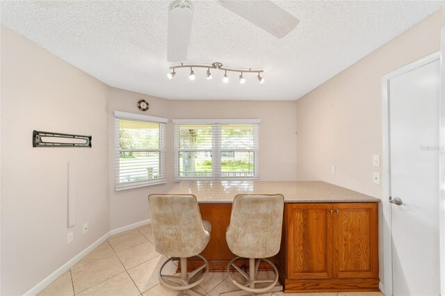9085 SW 96th Ln Unit B, Ocala, FL 34481 - dining room featuring light tile patterned floors and a textured ceiling