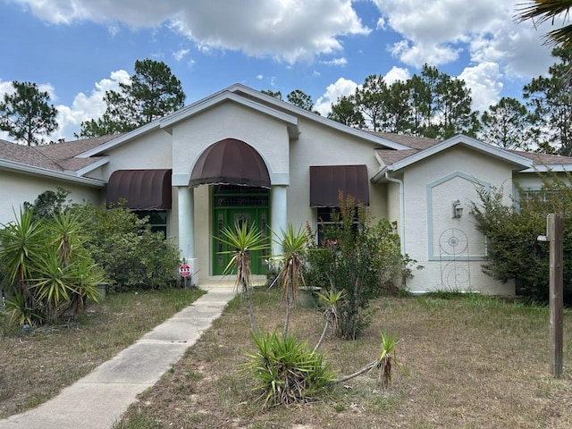 5408 W Corral Pl, Beverly Hills, FL 34465 - view of front of property featuring stucco siding and roof with shingles