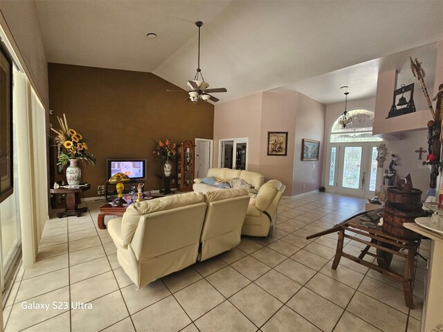 5408 W Corral Pl, Beverly Hills, FL 34465 - living room with light tile patterned flooring, a ceiling fan, a chandelier, and high vaulted ceiling
