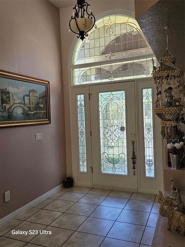 5408 W Corral Pl, Beverly Hills, FL 34465 - foyer entrance featuring tile patterned floors, a towering ceiling, and a textured wall