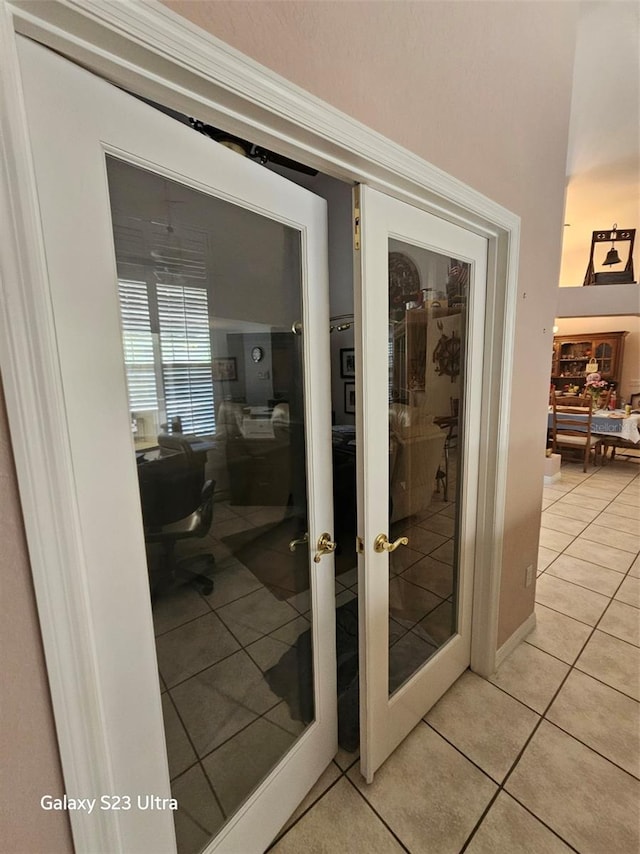 5408 W Corral Pl, Beverly Hills, FL 34465 - entryway with light tile patterned floors, an office area, and french doors