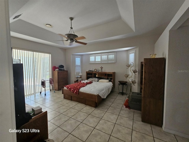 5408 W Corral Pl, Beverly Hills, FL 34465 - bedroom with light tile patterned floors, a tray ceiling, and ceiling fan