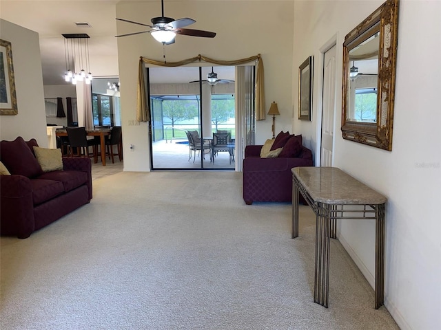 9923 SE 64th Ave, Belleview, FL 34420 - living area featuring light carpet and ceiling fan