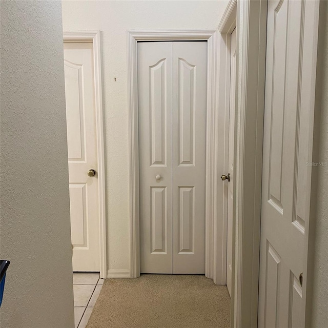 9923 SE 64th Ave, Belleview, FL 34420 - hall with light tile patterned floors and a textured wall