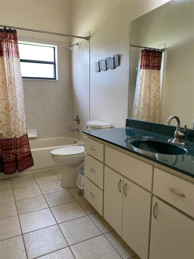 9923 SE 64th Ave, Belleview, FL 34420 - bathroom featuring shower / bath combo, vanity, tile patterned flooring, and a textured wall