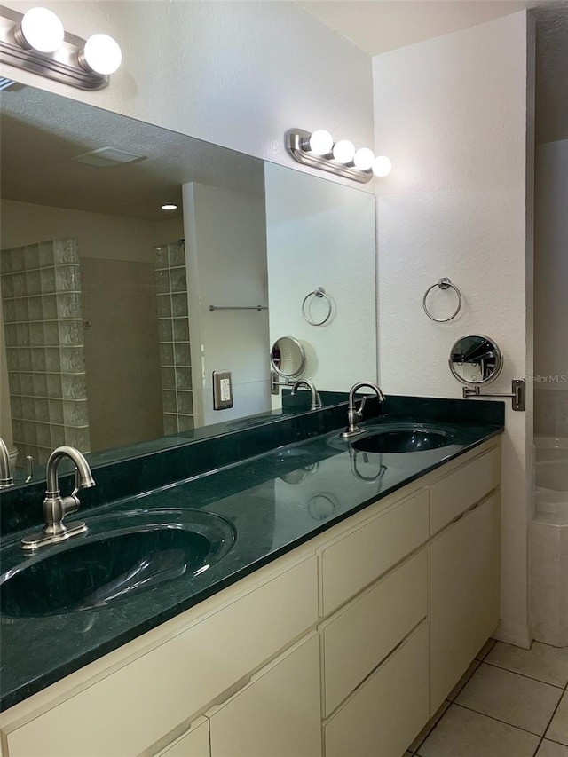 9923 SE 64th Ave, Belleview, FL 34420 - bathroom with tile patterned floors, double vanity, and a bath