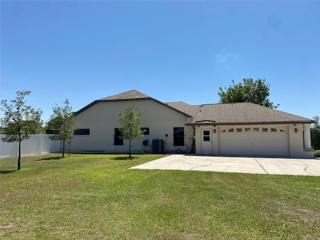 9923 SE 64th Ave, Belleview, FL 34420 - view of front of property featuring a garage, stucco siding, and concrete driveway