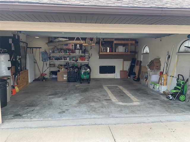 9923 SE 64th Ave, Belleview, FL 34420 - garage featuring heating unit and freestanding refrigerator