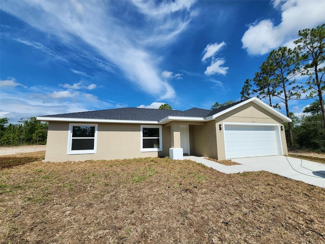 1780 Winding Hills Rd, Dunnellon, FL 34431 - ranch-style house with stucco siding, concrete driveway, and an attached garage