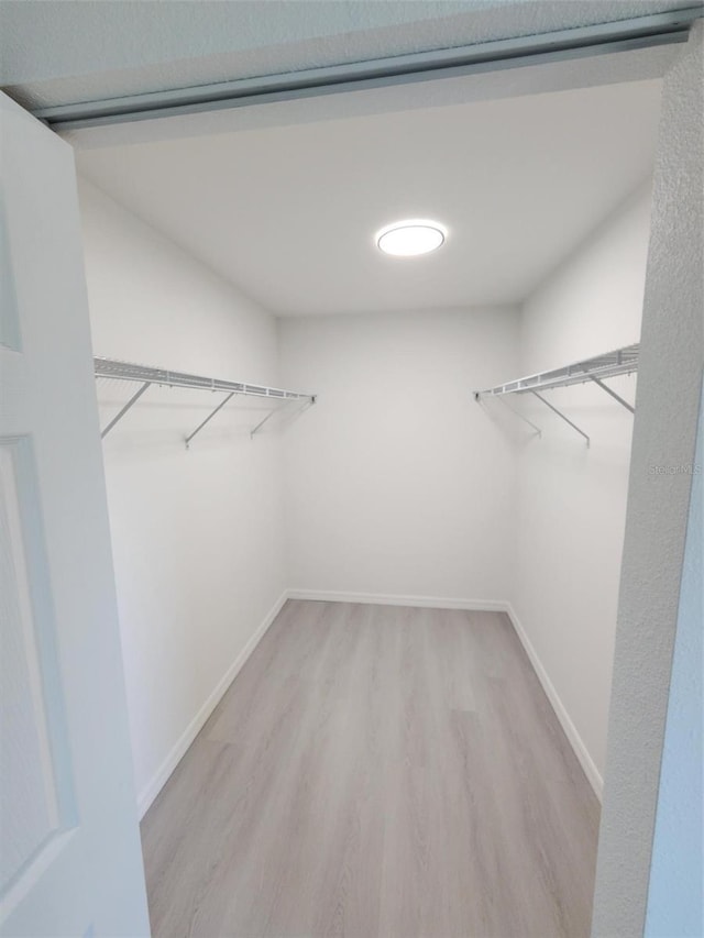1780 Winding Hills Rd, Dunnellon, FL 34431 - spacious closet featuring light wood-type flooring