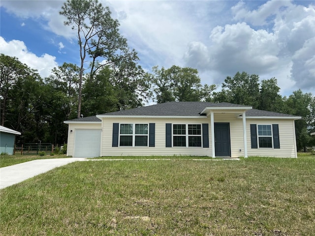 185 Malauka Loop, Ocklawaha, FL 32179 - single story home featuring driveway, a front lawn, and a garage