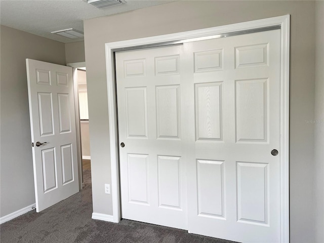 185 Malauka Loop, Ocklawaha, FL 32179 - unfurnished bedroom featuring dark colored carpet and a closet