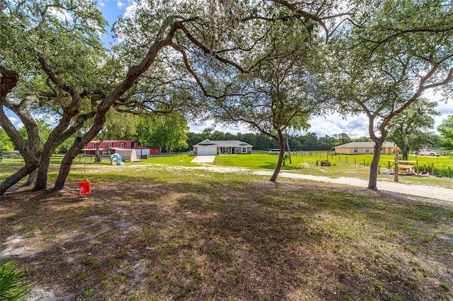 7435 N Nature Trl, Hernando, FL 34442 - view of yard featuring a detached garage and dirt driveway