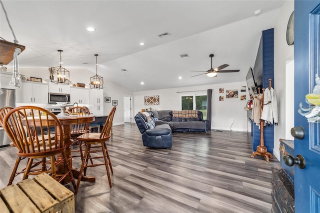 7435 N Nature Trl, Hernando, FL 34442 - dining room featuring lofted ceiling, ceiling fan, dark wood finished floors, recessed lighting, and a chandelier