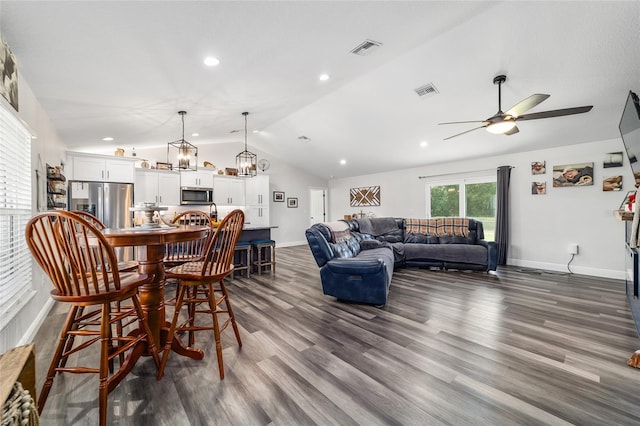 7435 N Nature Trl, Hernando, FL 34442 - dining room with lofted ceiling, a ceiling fan, dark wood-type flooring, recessed lighting, and a chandelier