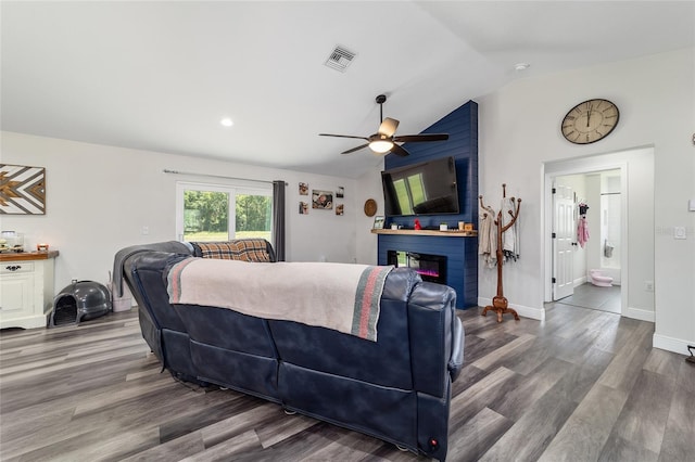 7435 N Nature Trl, Hernando, FL 34442 - living room with a ceiling fan, vaulted ceiling, wood finished floors, a fireplace, and recessed lighting