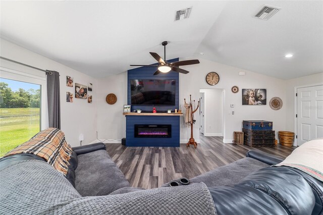 7435 N Nature Trl, Hernando, FL 34442 - living room with wood finished floors, a ceiling fan, lofted ceiling, and a glass covered fireplace
