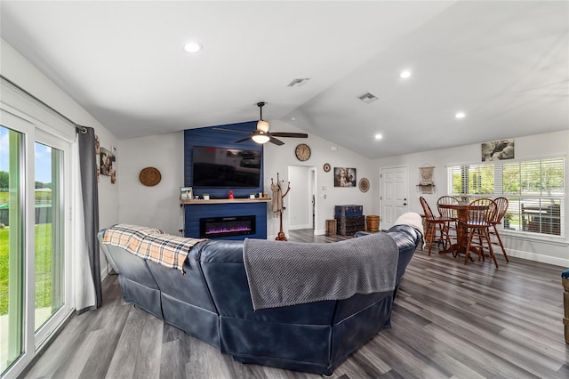 7435 N Nature Trl, Hernando, FL 34442 - living room featuring a ceiling fan, plenty of natural light, wood finished floors, lofted ceiling, and a glass covered fireplace