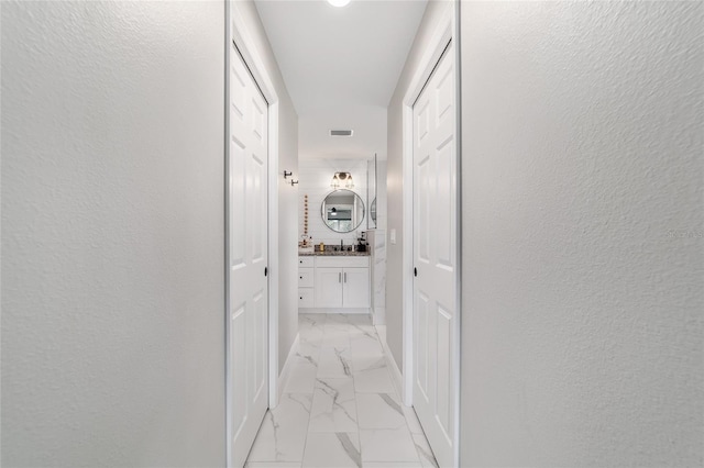 7435 N Nature Trl, Hernando, FL 34442 - hallway with light marble finish flooring and a textured wall