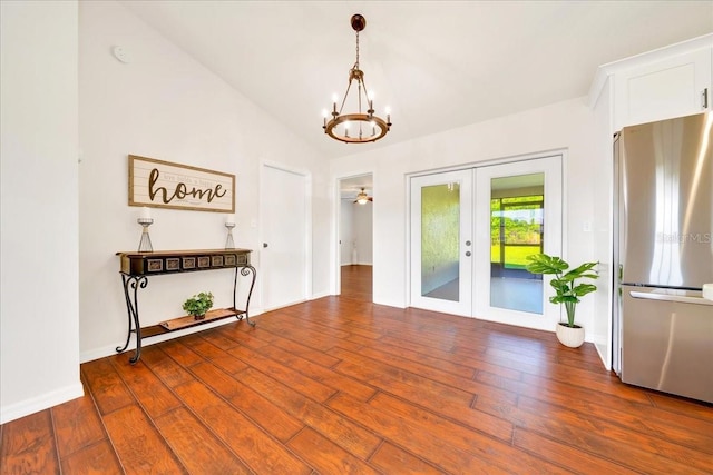 6142 SE 37th Ter, Ocala, FL 34480 - unfurnished dining area featuring french doors, a chandelier, wood finished floors, and lofted ceiling