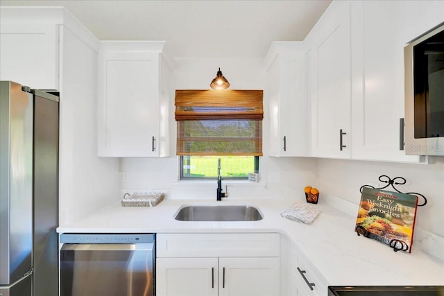 6142 SE 37th Ter, Ocala, FL 34480 - kitchen featuring stainless steel appliances, white cabinets, and light countertops